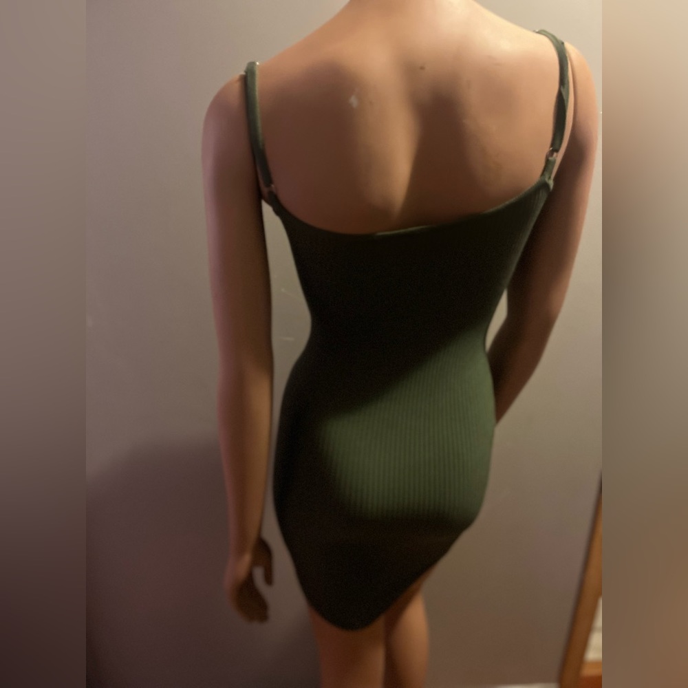 Green fitted dress.